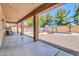 Expansive backyard with a covered patio, sparkling pool, and a lush landscape perfect for outdoor living at 742 E Kingbird Dr, Gilbert, AZ 85297