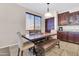 Cozy dining area with a rustic wooden table and a pendant light fixture at 742 E Kingbird Dr, Gilbert, AZ 85297