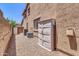 Exterior side yard view with gravel, storage shed, and multiple air conditioning units at 742 E Kingbird Dr, Gilbert, AZ 85297