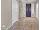 Entrance foyer featuring a large tile floor, grand door, and white-painted trim at 742 E Kingbird Dr, Gilbert, AZ 85297