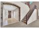 Spacious foyer features an impressive staircase with iron railings and an open layout at 742 E Kingbird Dr, Gilbert, AZ 85297