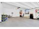 Clean and organized garage features built-in storage and space for parking and hobbies at 742 E Kingbird Dr, Gilbert, AZ 85297