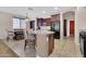 Kitchen with granite island featuring barstool seating and views into the dining area at 742 E Kingbird Dr, Gilbert, AZ 85297