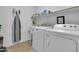 This laundry room features a washing machine, dryer, sink and lots of storage space at 742 E Kingbird Dr, Gilbert, AZ 85297