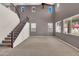 Open living room with high ceilings and abundant natural light from multiple windows at 742 E Kingbird Dr, Gilbert, AZ 85297