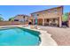 Inviting backyard pool area with beautiful desert landscaping and patio area at 742 E Kingbird Dr, Gilbert, AZ 85297