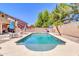 A refreshing swimming pool with lounge chairs in a well maintained backyard at 742 E Kingbird Dr, Gilbert, AZ 85297