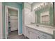 Clean bathroom featuring white vanity and ample storage, next to a shower and bath combination at 750 E Northern Ave # 2088, Phoenix, AZ 85020