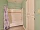 Bright bathroom with a shower and tub, storage, and stylish fixtures at 750 E Northern Ave # 2088, Phoenix, AZ 85020