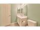 A bathroom featuring a vanity, mirror and toilet with coordinated colors at 750 E Northern Ave # 2088, Phoenix, AZ 85020