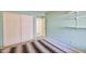View of a carpeted bedroom with a closet featuring sliding doors and interior doors at 750 E Northern Ave # 2088, Phoenix, AZ 85020