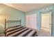 This bedroom features carpet, a closet, and access to other rooms at 750 E Northern Ave # 2088, Phoenix, AZ 85020