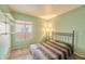 Serene bedroom featuring soft carpet, a large window, and calming color scheme perfect for resting at 750 E Northern Ave # 2088, Phoenix, AZ 85020