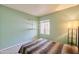 A cozy bedroom featuring a window, built-in shelves, and soft carpet at 750 E Northern Ave # 2088, Phoenix, AZ 85020