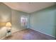 Cozy bedroom features soft carpet, a large window, and calming color scheme perfect for relaxing at 750 E Northern Ave # 2088, Phoenix, AZ 85020