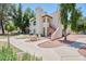 View of a condo building with stucco walls and a staircase leading to the upper level at 750 E Northern Ave # 2088, Phoenix, AZ 85020