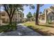 Exterior view of complex buildings with walking paths, mature trees, and landscaped grounds at 750 E Northern Ave # 2088, Phoenix, AZ 85020