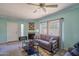 Comfortable living room with neutral colored sofa, fireplace, and an abundance of natural light at 750 E Northern Ave # 2088, Phoenix, AZ 85020
