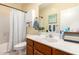 Bathroom featuring vanity, soaking tub, and natural light at 7923 W Hess Ave, Phoenix, AZ 85043