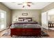 Spacious primary bedroom with wood flooring, ceiling fan, and a walk-out patio at 7923 W Hess Ave, Phoenix, AZ 85043