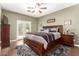 Spacious primary bedroom with wood flooring, ceiling fan, and a walk-out patio at 7923 W Hess Ave, Phoenix, AZ 85043