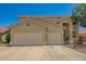 Charming two-story home with a three car garage and desert landscaping at 7923 W Hess Ave, Phoenix, AZ 85043