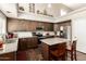 Beautiful kitchen with stainless steel appliances, granite countertops, kitchen island, and high ceilings with lots of light at 7923 W Hess Ave, Phoenix, AZ 85043