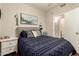 Well-lit main bedroom with hardwood floors and stylish decor at 7923 W Hess Ave, Phoenix, AZ 85043