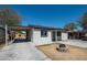 View of front yard of this single Gathering home with gray paint and desert landscape at 826 S Drew St, Mesa, AZ 85210