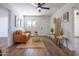 Bright living room featuring wood flooring, neutral walls, and tasteful decorations at 826 S Drew St, Mesa, AZ 85210