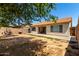 Backyard offering mature landscaping, block fencing, and privacy at 8341 W Cypress St, Phoenix, AZ 85037