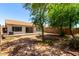 Backyard featuring a patio and mature landscaping at 8341 W Cypress St, Phoenix, AZ 85037