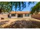 The backyard is designed for relaxation with mature trees at 8341 W Cypress St, Phoenix, AZ 85037