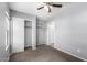 Bedroom with gray walls, neutral carpet, and closet doors to the left at 8341 W Cypress St, Phoenix, AZ 85037