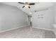 Bright living area features wood-look tile floors, vaulted ceiling and neutral gray paint at 8341 W Cypress St, Phoenix, AZ 85037