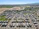 Wide aerial shot showcasing a Primary-planned community with homes, parks, and roadways at 880 S 150Th Dr, Goodyear, AZ 85338
