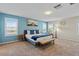 Comfortable bedroom with a queen bed, neutral decor, sitting area, and a relaxing atmosphere at 880 S 150Th Dr, Goodyear, AZ 85338