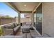 Relaxing covered patio with comfortable seating, perfect for outdoor entertaining and relaxation at 880 S 150Th Dr, Goodyear, AZ 85338