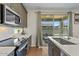 Modern kitchen with stainless steel appliances and white quartz counters at 880 S 150Th Dr, Goodyear, AZ 85338