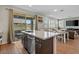Stylish kitchen island features a stainless steel dishwasher and a sink at 880 S 150Th Dr, Goodyear, AZ 85338