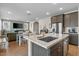 Modern open kitchen with stainless steel appliances and center island at 880 S 150Th Dr, Goodyear, AZ 85338