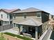Two-story home featuring a covered patio, pavers, gravel and artificial turf at 880 S 150Th Dr, Goodyear, AZ 85338