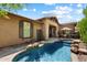 Resort-style pool area with a tanning ledge, spa, and outdoor dining space at 9262 E Desert Park Dr, Scottsdale, AZ 85255