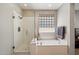 Beautiful bathroom with a luxurious soaking tub and separate glass-enclosed shower at 9262 E Desert Park Dr, Scottsdale, AZ 85255