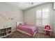 bedroom with plush carpet, bright light and a playful decor with shelving unit at 9262 E Desert Park Dr, Scottsdale, AZ 85255