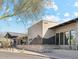 Modern community center with stone accents, sleek windows, and well-maintained landscaping, showcasing a welcoming entrance at 9262 E Desert Park Dr, Scottsdale, AZ 85255