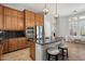 Well-equipped kitchen with a center island, stainless steel appliances, and wooden cabinets at 9262 E Desert Park Dr, Scottsdale, AZ 85255