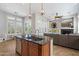 Open-concept kitchen featuring an island with seating and views of the living area at 9262 E Desert Park Dr, Scottsdale, AZ 85255