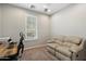 Office space with a comfortable leather sofa, plush carpet and lots of natural light at 9262 E Desert Park Dr, Scottsdale, AZ 85255