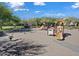 Community playground features swings, slides, and a rocking horse, providing a fun and safe environment for children at 9262 E Desert Park Dr, Scottsdale, AZ 85255